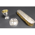 A group of thee silver items, comprising a silver egg cup with gilt interior, S J Rose & Son, Birmin... 