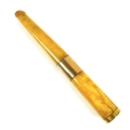 A mid 20th century 9ct gold mounted amber cheroot holder, with yellow metal band to its middle, a/f,... 