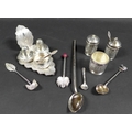 A collection of Eastern white metal cruet sets and spoons, including one set comprising salt cellar,... 