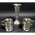 A group of three silver items, comprising a trumpet shaped vase with wave rim and spiral fluted deco... 