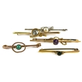 A group of five bar brooches, comprising a 15ct gold and aquamarine brooch, 5.1g, an amethyst set br... 