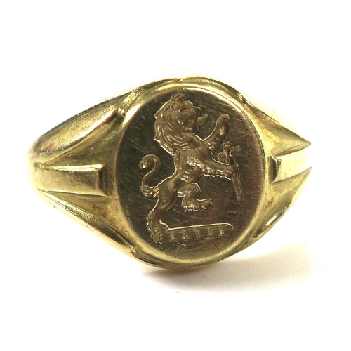 317 - An 18ct gold signet ring, engraved with lion rampant gardant, holding a cross or sword to the oval s... 