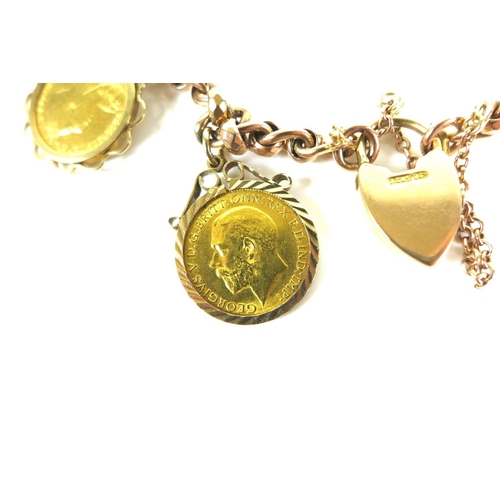 320 - A 9ct gold chain bracelet, fitted with two 9ct gold mounted half sovereign pendants, one a Victorian... 