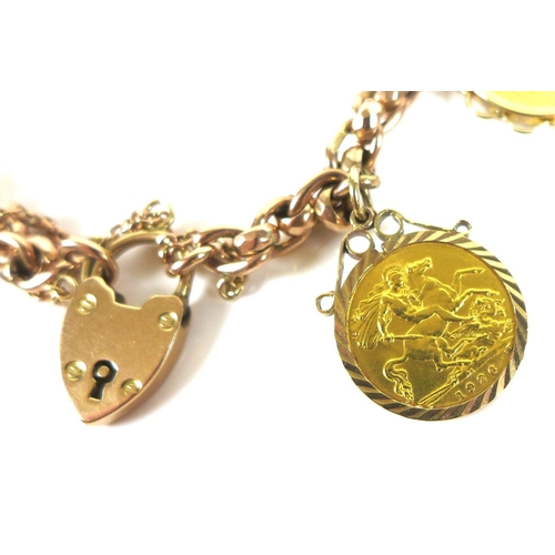 320 - A 9ct gold chain bracelet, fitted with two 9ct gold mounted half sovereign pendants, one a Victorian... 