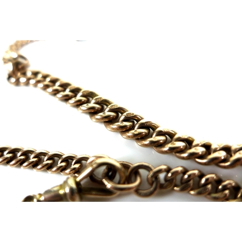 323 - A Victorian 9ct gold graduated double Albert fob chain, with two graduating kerb link chains termina... 