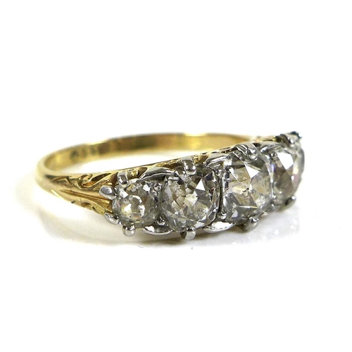 326 - An 18ct gold and diamond five stone ring, the central stone approximately 0.5ct, 4.9 by 4.9mm, small... 