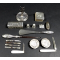 A collection of Victorian and later silver vertu, including a miniature manicure set with silver han... 