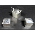 A silver Art Deco cruet set, comprising salt, pepper and mustard pot, all of cube form with gently a... 