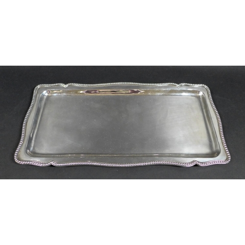 63 - An Egyptian 800 silver tray, or rectangular form with shaped outline and decorative bead border, mar... 