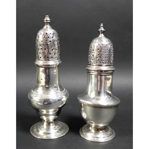 64 - Two George II silver sugar castors, both of baluster form with engraved decoration to the pierced co... 