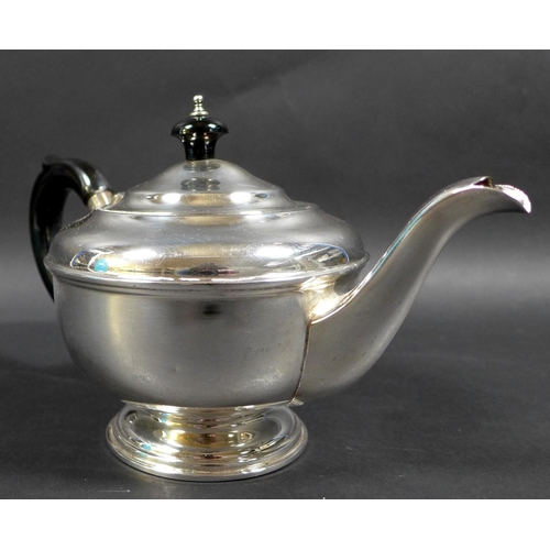 70 - An Art Deco silver bachelor's teapot, of squat stepped ovoid form, with ebony handle and finial, rai... 