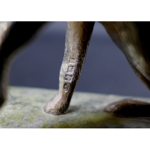 74 - A pair of contemporary silver sculptures, each modelled realistically as a hare, in seated pose with... 