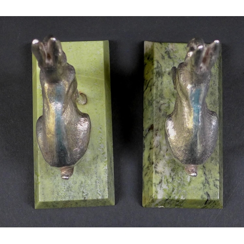 74 - A pair of contemporary silver sculptures, each modelled realistically as a hare, in seated pose with... 