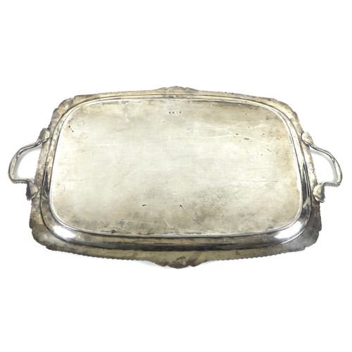 78 - A large Edward VII silver twin handled serving tray, with gadrooned and shell clasped rim, the centr... 
