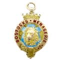 An Edward VII 9ct gold medallion, of circular form with a central relief cast and pale blue enamelle... 