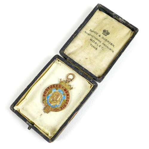 89 - An Edward VII 9ct gold medallion, of circular form with a central relief cast and pale blue enamelle... 