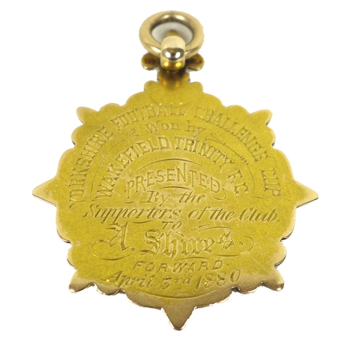 90 - A rare Victorian 15ct gold sporting winners medal, of circular form with a central relief cast round... 