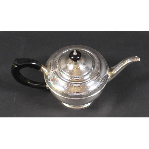 70 - An Art Deco silver bachelor's teapot, of squat stepped ovoid form, with ebony handle and finial, rai... 