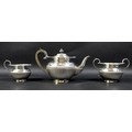 A George V three piece silver tea service, of ovoid form with part reeded lower bodies and decorativ... 