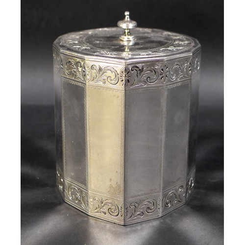 77 - A George III silver tea caddy, of fourteen sided navette form, the oval flush hinged cover with knop... 