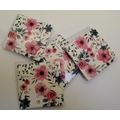 Set of 4 ceramic coasters with red rose designs. 4 rubber cushion pads on bottom. Stored in display ... 