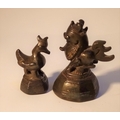 Two Burmese cast bronze opium weights.  Largest 5cm high. Mid 20th c. Notes:  The heavier one is a m... 