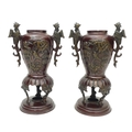 A pair of decorative 20th century bronze vases, decorated with birds in prunus blossom and pheonix h... 