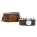A vintage 1930s Leica camera, with Leitz Elmar 1:3.5 f=50mm lens, serial no. 168496, with chrome and... 