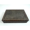 An Edwardian carved wooden box, decorated throughout with scrolling foliage and arabesques, with fau... 