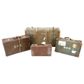 A group of four vintage suitcases, the largest wooden bound and canvas covered, 51 by 91 by 31 cm hi... 