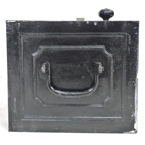 162 - A cast iron strongbox, circa 1900, painted black, with hinged lid and carry handles to side, with tw... 