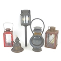 A group of vintage lamps, comprising a Shand & Mason Fire Engine lamp, 11 by 9 by 41cm long, an earl... 