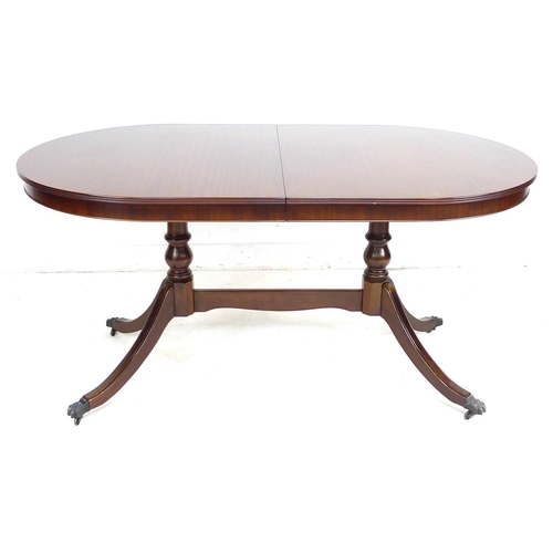 176 - A modern reproduction extending dining table, in Regency style, of D end form with twin pedestals an... 