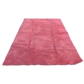 A large contemporary 'Opus Shaggy' rug, with crimson ground, 245 by 345cm.