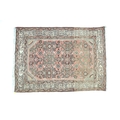 A small Persian prayer rug, with pale red ground, 120 by 85cm.