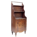 A narrow Victorian mahogany waterfall bookcase, with turned rail above two shelves, cupboard below e... 