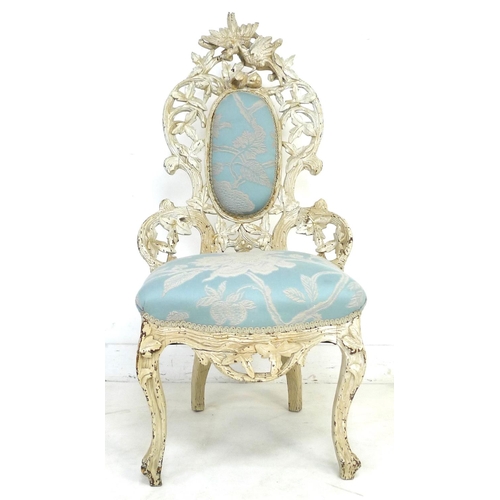 207 - A Victorian nursing chair with cream painted carved frame, raised on cabriole legs to the front and ... 