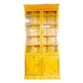 A modern pine bookcase, twin glazed doors, each with ten panes, enclosing four shelves, slide with l... 