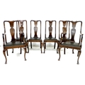 A set of six early 20th century oak dining chairs,  52 by 55 by 106cm high,  in Queen Anne style wit... 