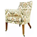 An early Victorian armchair, with deep seat and squared tub shaped back, upholstered in floral embro... 
