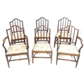 A set of six early 19th century mahogany dining chairs, each 52 by 51 96cm high, including two carve... 