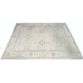 A modern Persian carpet with cream ground, pale floral multi coloured decoration, wide scrolling flo... 