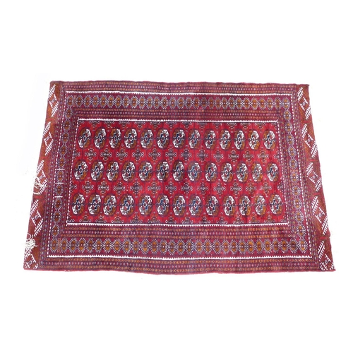 256 - A Tekke rug, with red ground, 130 by 200cm