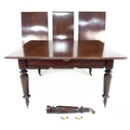 A Victorian mahogany dining table, with turned legs on castors, and pull-out action three additional... 