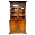 A George IV / William IV mahogany bookcase, by Wilkinson, Ludgate Hill, twin astragal glazed doors e... 