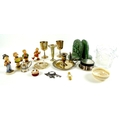 A group of collectables, including four Goebels Hummel figures, a pair of soapstone bookends, modell... 