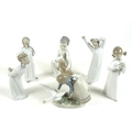 A group of six Lladro figures, comprising Wild Goose Chase, number 5553, 15cm high, Nino con Perro, ... 
