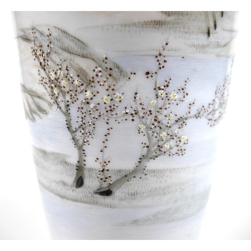 7 - A Japanese Satsuma pottery vase, decorated with a continuous landscape, cherry blossoms, trees and h... 