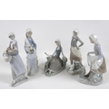 A group of five Lladro figures, comprising Armful of Lilies, number 4972, 24cm high, Peasant Girl wi... 