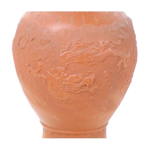 8 - A Chinese Yixing pottery vase, early to mid 20th century, with incised decoration of a dragon amidst... 